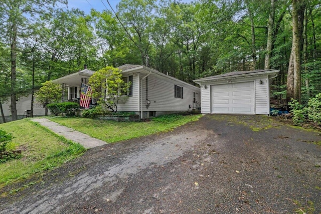 2726 Pocono Cir, Bartonsville, PA 18321 - view of front of house with asphalt driveway, a detached garage, and an outdoor structure
