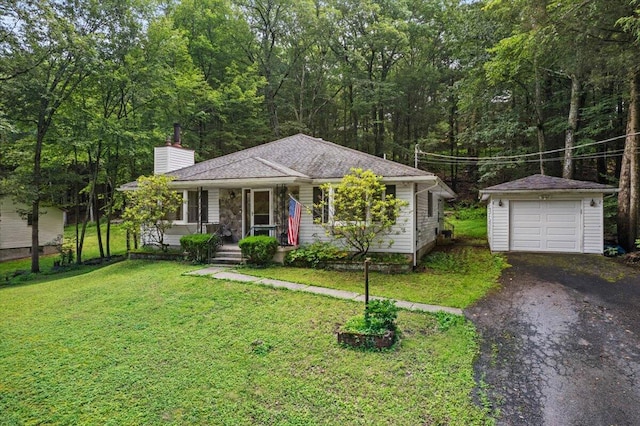 2726 Pocono Cir, Bartonsville, PA 18321 - view of front of home with a porch, a chimney, an outbuilding, asphalt driveway, and a garage