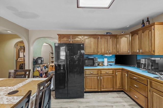 2726 Pocono Cir, Bartonsville, PA 18321 - kitchen featuring black appliances, light countertops, brown cabinets, and light wood-type flooring