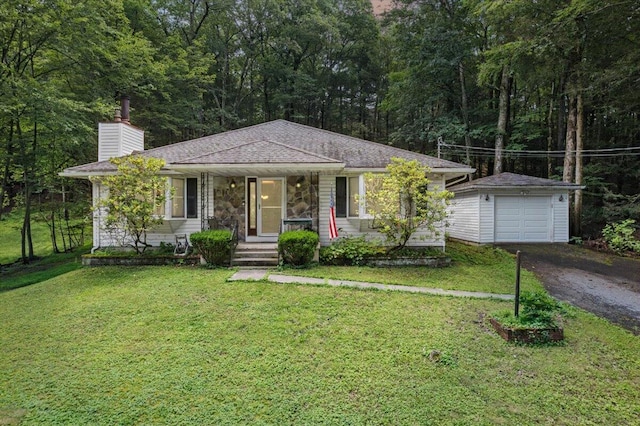 2726 Pocono Cir, Bartonsville, PA 18321 - view of front facade with driveway, a chimney, an outdoor structure, covered porch, and a front yard
