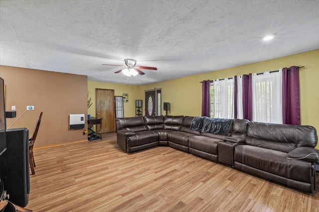 2726 Pocono Cir, Bartonsville, PA 18321 - living area with light wood-style flooring, a ceiling fan, and a textured ceiling