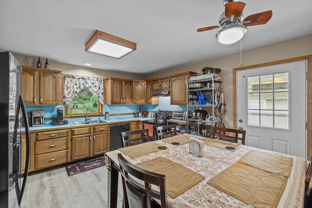 2726 Pocono Cir, Bartonsville, PA 18321 - kitchen featuring black appliances, a ceiling fan, brown cabinetry, and light wood-style floors