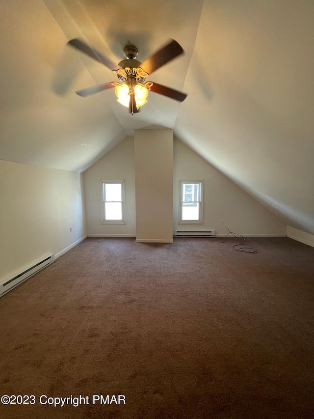 additional living space with lofted ceiling, carpet, baseboard heating, and a ceiling fan