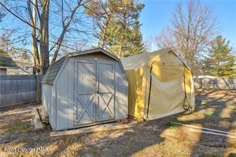 view of shed featuring a fenced backyard