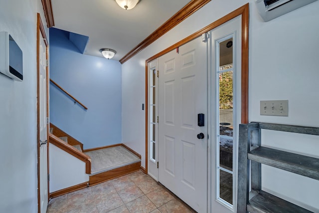 entryway featuring a wall mounted air conditioner, stairs, baseboards, and ornamental molding