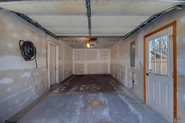 garage with electric panel and a garage door opener