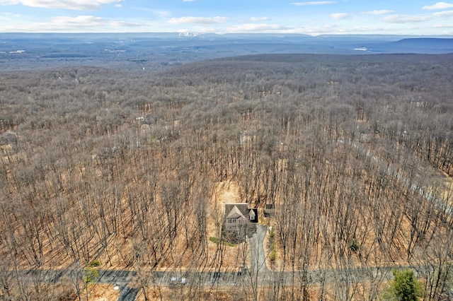 bird's eye view with a wooded view and a mountain view