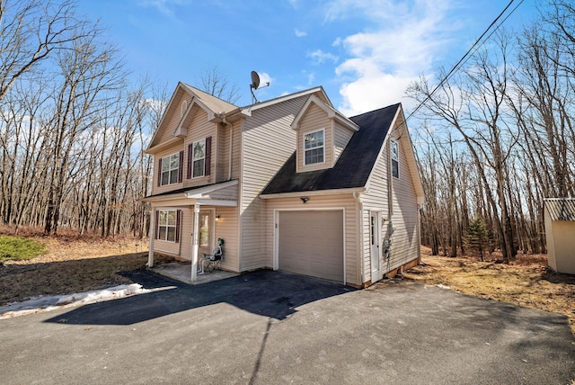 view of home's exterior with aphalt driveway