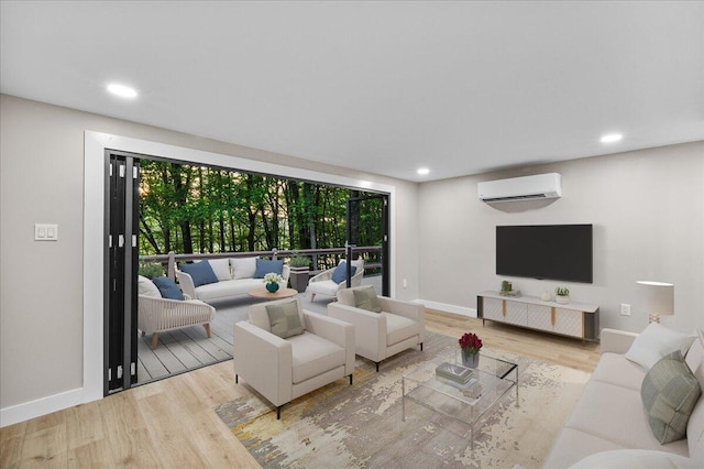 173 Water View Dr, Hawley, PA 18428 - living room featuring an AC wall unit, wood finished floors, and recessed lighting