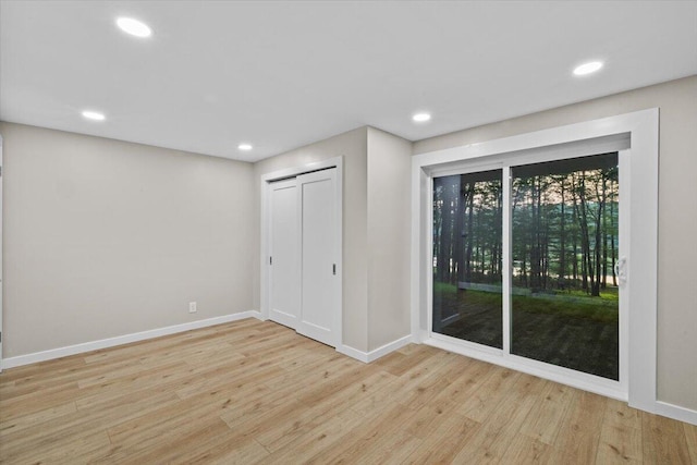173 Water View Dr, Hawley, PA 18428 - unfurnished bedroom featuring wood finished floors, access to outside, recessed lighting, and a closet