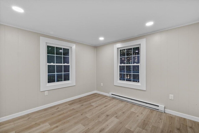 173 Water View Dr, Hawley, PA 18428 - unfurnished room featuring a baseboard radiator, wood finished floors, and recessed lighting