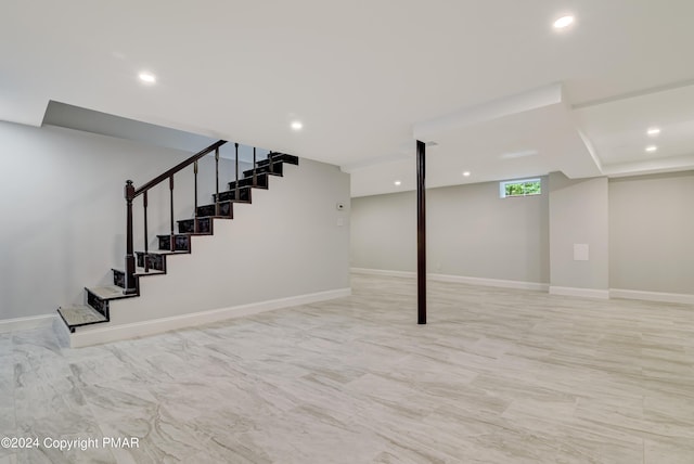 basement with recessed lighting, baseboards, and stairs