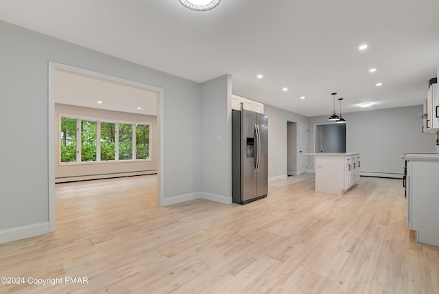 kitchen with white cabinetry, stainless steel fridge with ice dispenser, baseboard heating, a center island, and light wood finished floors