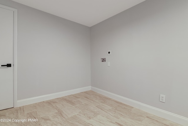 unfurnished room featuring baseboards