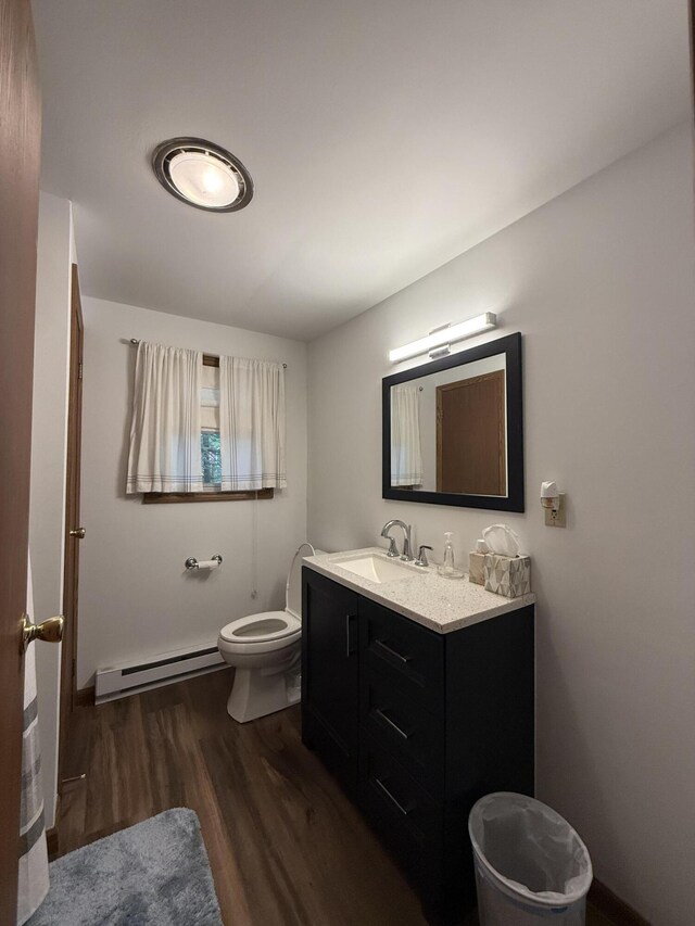 281 Fern Ridge Rd, Blakeslee, PA 18610 - bathroom with a baseboard radiator, wood finished floors, and vanity