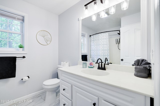 full bathroom featuring baseboards, a shower with shower curtain, toilet, marble finish floor, and vanity