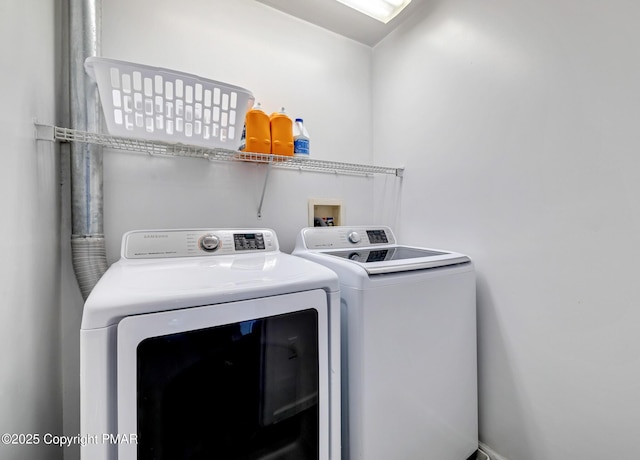 laundry area featuring laundry area and independent washer and dryer