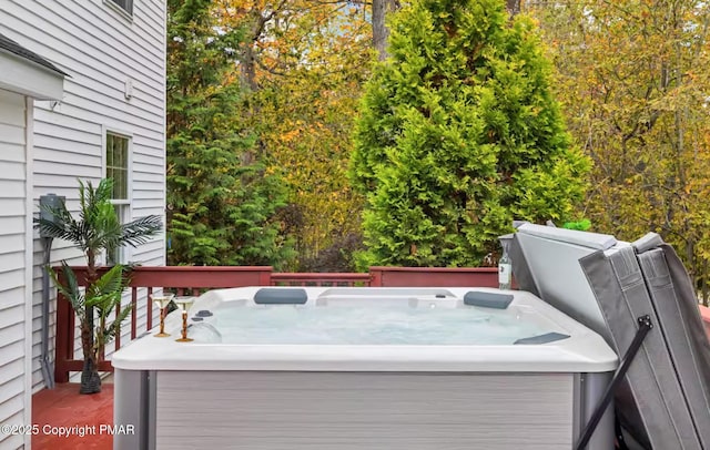 deck featuring a hot tub