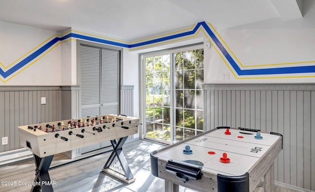 game room featuring wainscoting