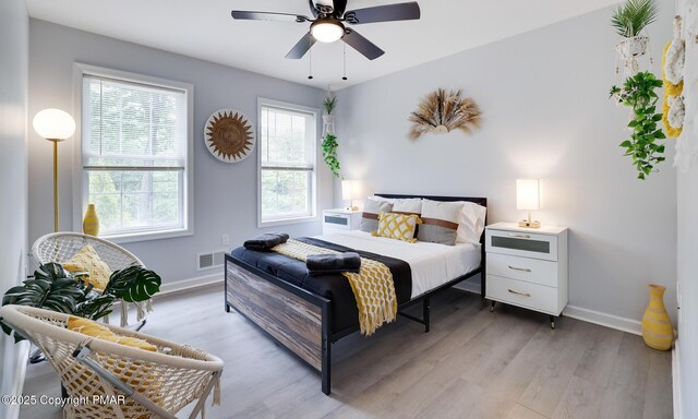 bedroom featuring ceiling fan and light wood-type flooring