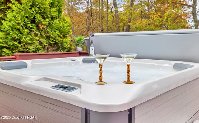exterior details featuring a jacuzzi