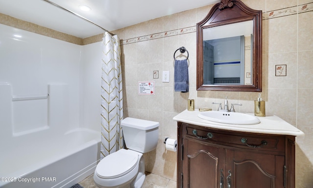 full bathroom featuring toilet, shower / tub combo, tile walls, and vanity