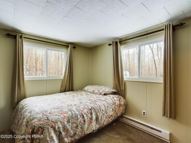 carpeted living room with vaulted ceiling with beams and a baseboard radiator