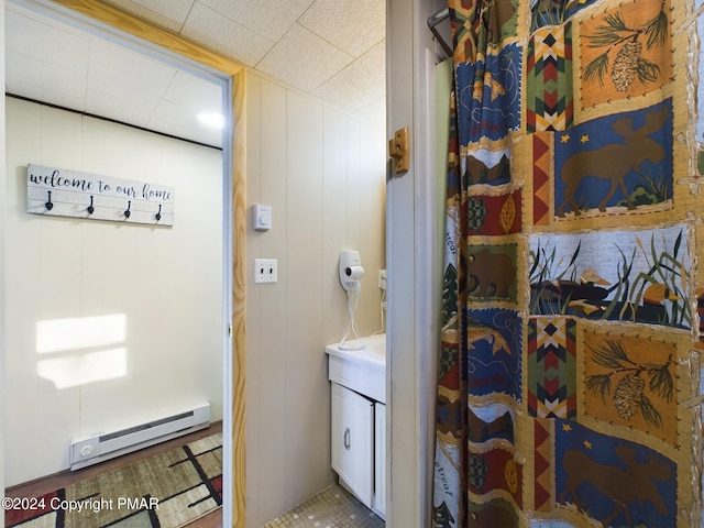 bathroom featuring a baseboard radiator and vanity