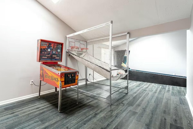 recreation room featuring baseboards and wood finished floors