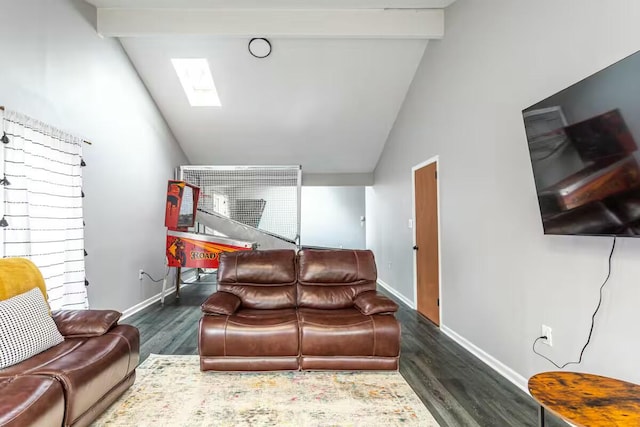 living area featuring beam ceiling, high vaulted ceiling, wood finished floors, a skylight, and baseboards