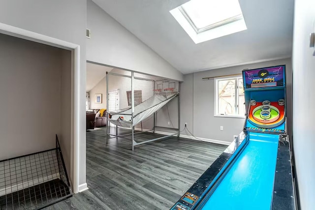 rec room featuring vaulted ceiling with skylight, wood finished floors, and baseboards