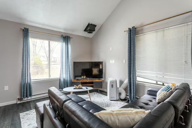 living area with a baseboard radiator, baseboards, dark wood finished floors, and vaulted ceiling