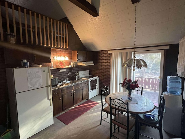 kitchen with white appliances, lofted ceiling, a sink, dark brown cabinetry, and under cabinet range hood