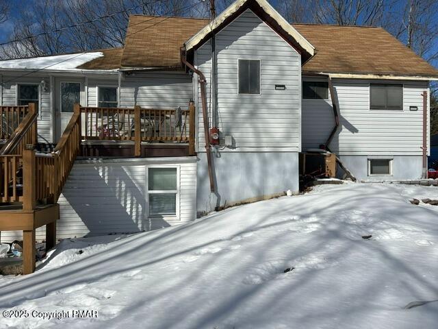 view of snow covered house