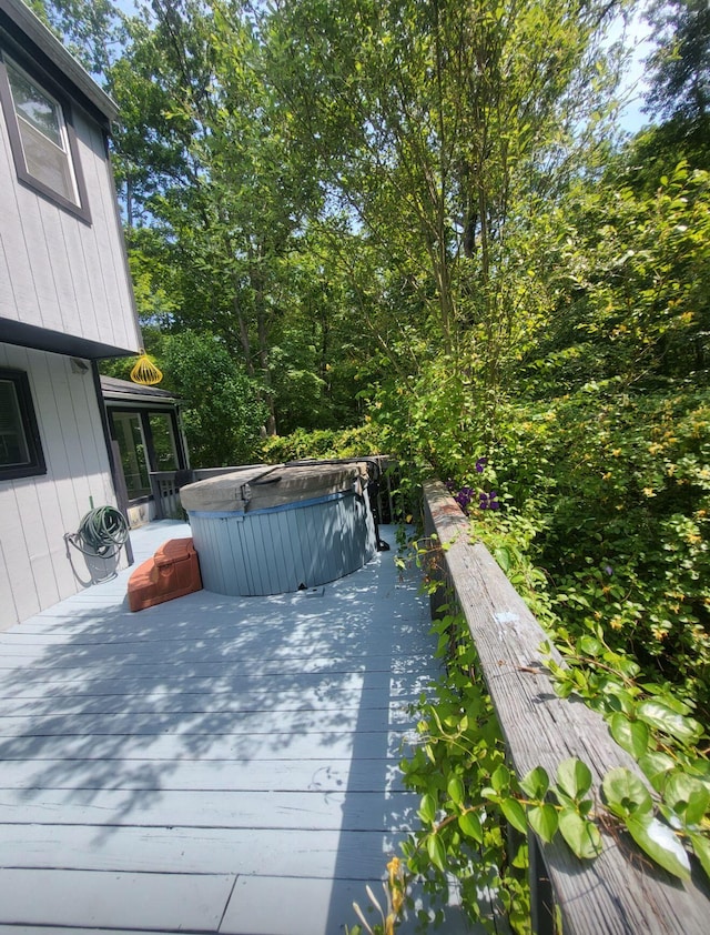 deck with a hot tub
