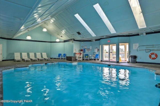 indoor pool featuring a skylight