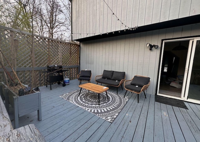 wooden terrace featuring grilling area