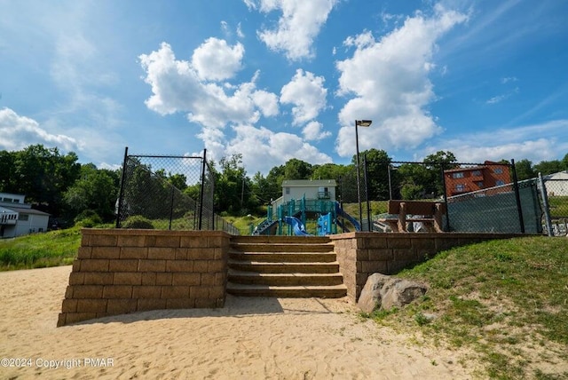view of property's community featuring fence