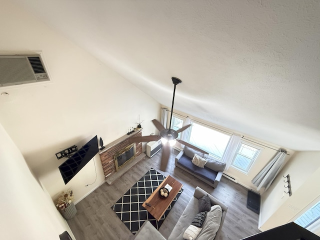 living room with lofted ceiling and wood finished floors
