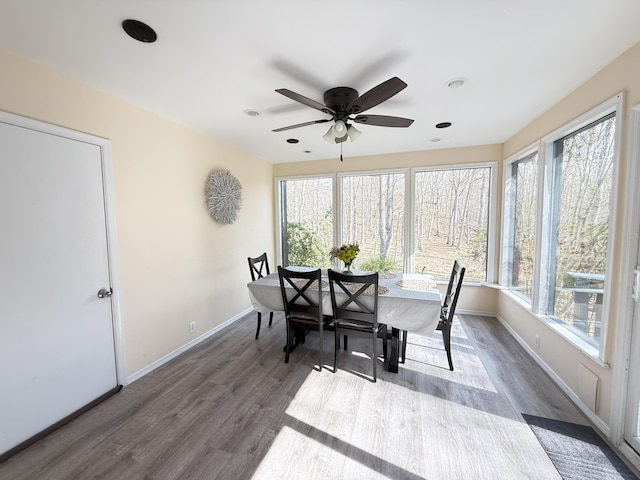 dining area featuring healthy amount of natural light, dark wood finished floors, a ceiling fan, and recessed lighting