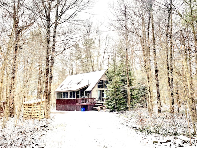 view of front of property with a wooden deck