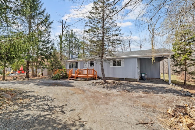 7724 Apple Ln, Tobyhanna, PA 18466 - view of front of house with a wooden deck and dirt driveway