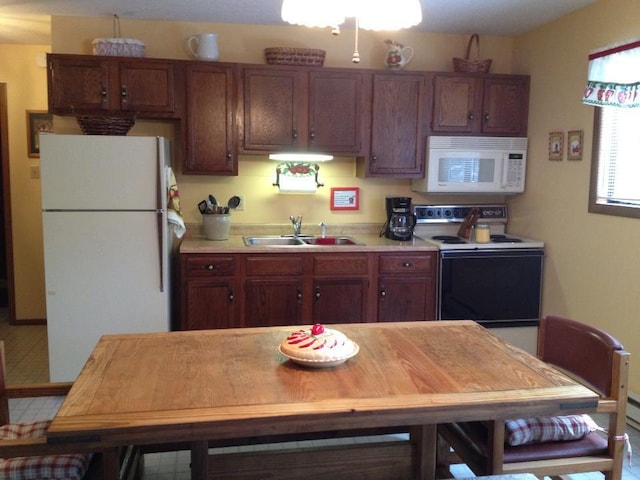 7724 Apple Ln, Tobyhanna, PA 18466 - kitchen with white appliances, a sink, and light countertops