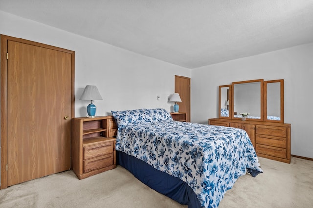 bedroom featuring light carpet