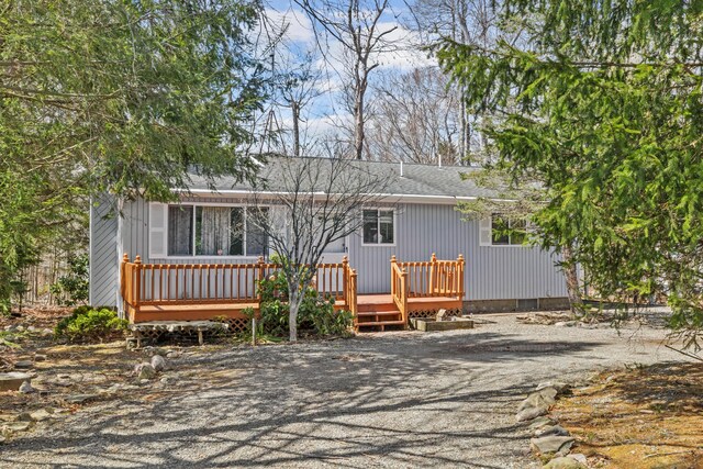 7724 Apple Ln, Tobyhanna, PA 18466 - view of front facade with a wooden deck and a shingled roof