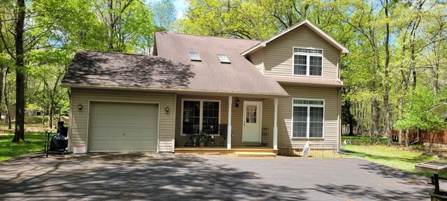 25 Byron Ln, Albrightsville, PA 18210 - view of front of property with asphalt driveway, a porch, an attached garage, and roof with shingles
