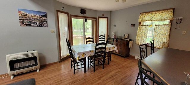 25 Byron Ln, Albrightsville, PA 18210 - dining room with heating unit, light wood-style floors, a baseboard radiator, and baseboards