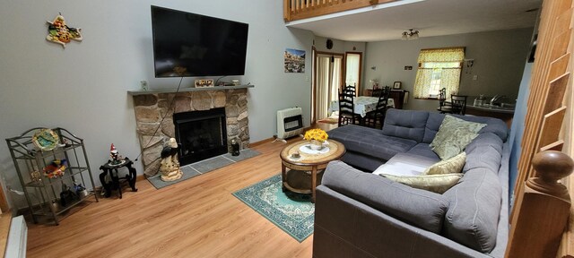 25 Byron Ln, Albrightsville, PA 18210 - living area with heating unit, wood finished floors, and a fireplace