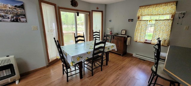 25 Byron Ln, Albrightsville, PA 18210 - dining area with heating unit, light wood finished floors, a baseboard heating unit, and baseboards