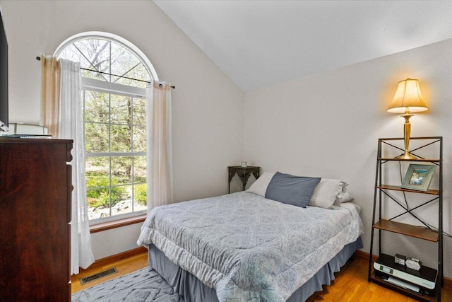 250 Grouse Run, Cresco, PA 18326 - bedroom featuring multiple windows, wood finished floors, vaulted ceiling, and baseboards